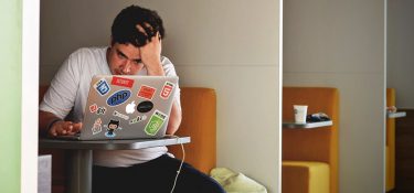 frustrated on laptop