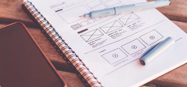 Website wireframe on notebook