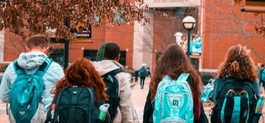 Students wearing backpacks
